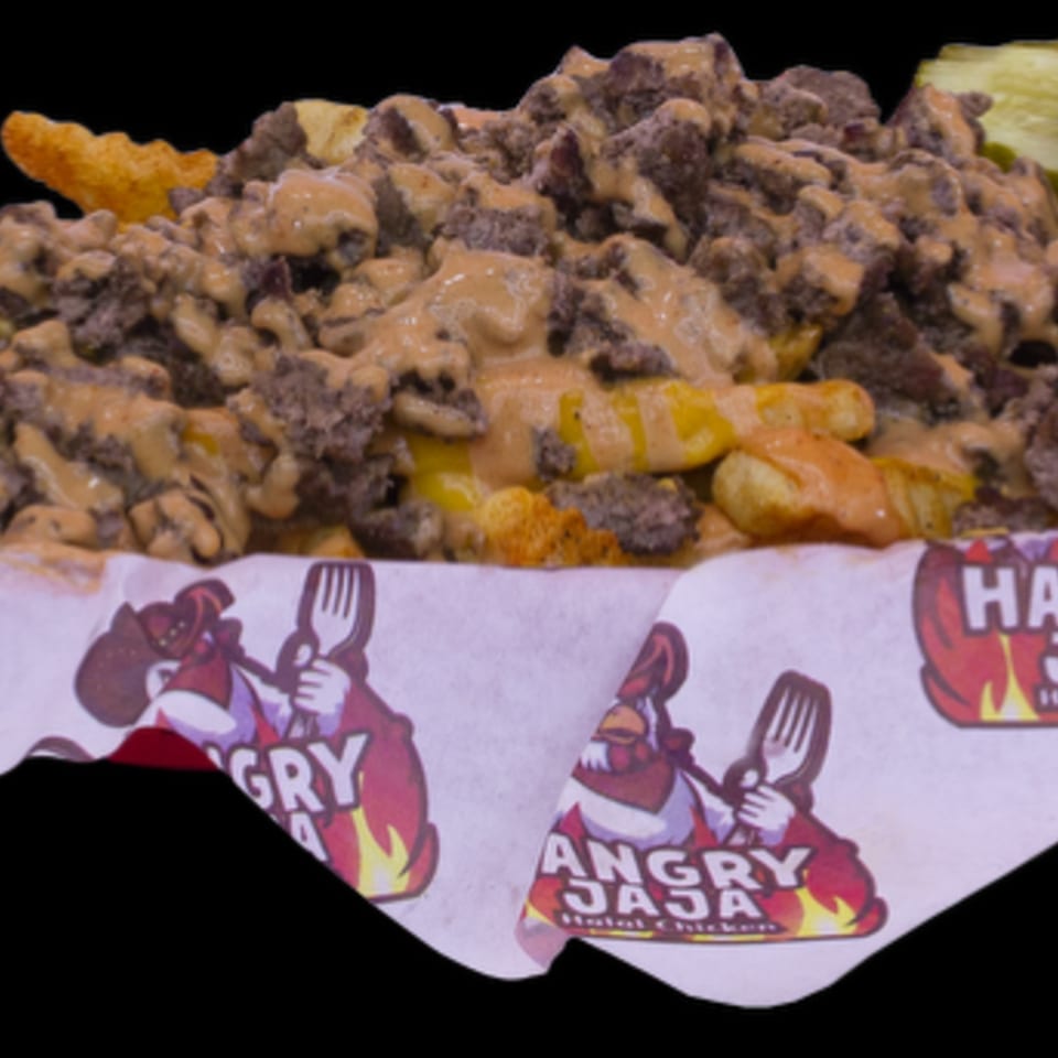 Waffle fries topped with chopped meat and creamy sauce, served in a basket with Angry Jaja branding.